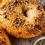 Sliced high protein bagel with Greek yogurt on rustic table